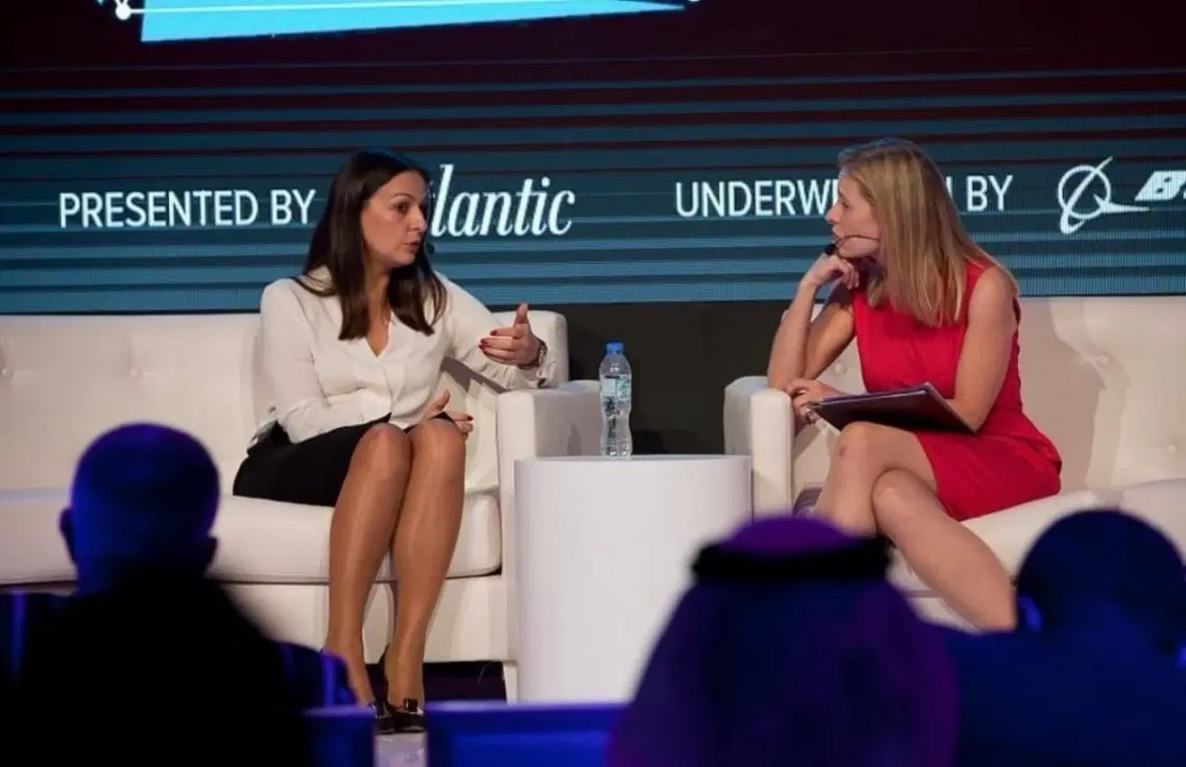 A Wave advisor in a fireside conversation on stage at a summit