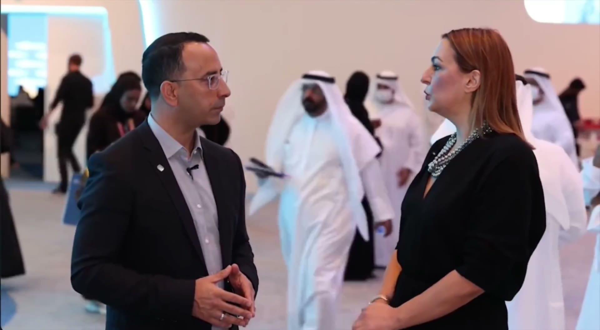 Wave advisors in conversation on set, in the office and at a UAE exhibition